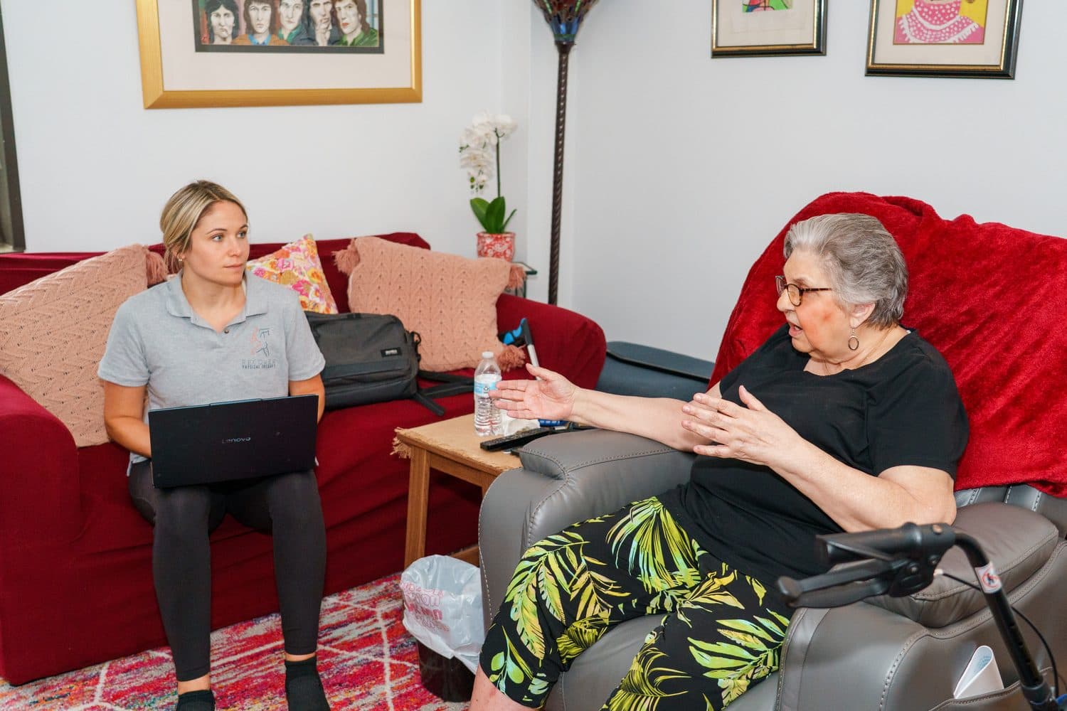 Nicole Ogletree listening to an older adult during an at-home therapy visit.